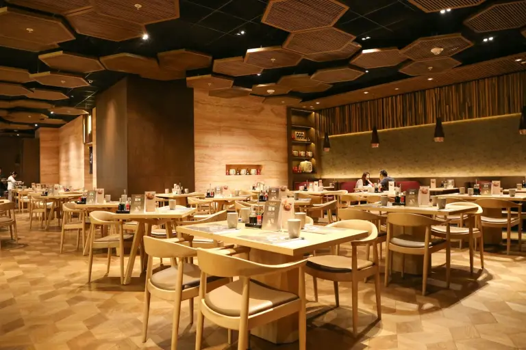 Warmly lit restaurant dining room